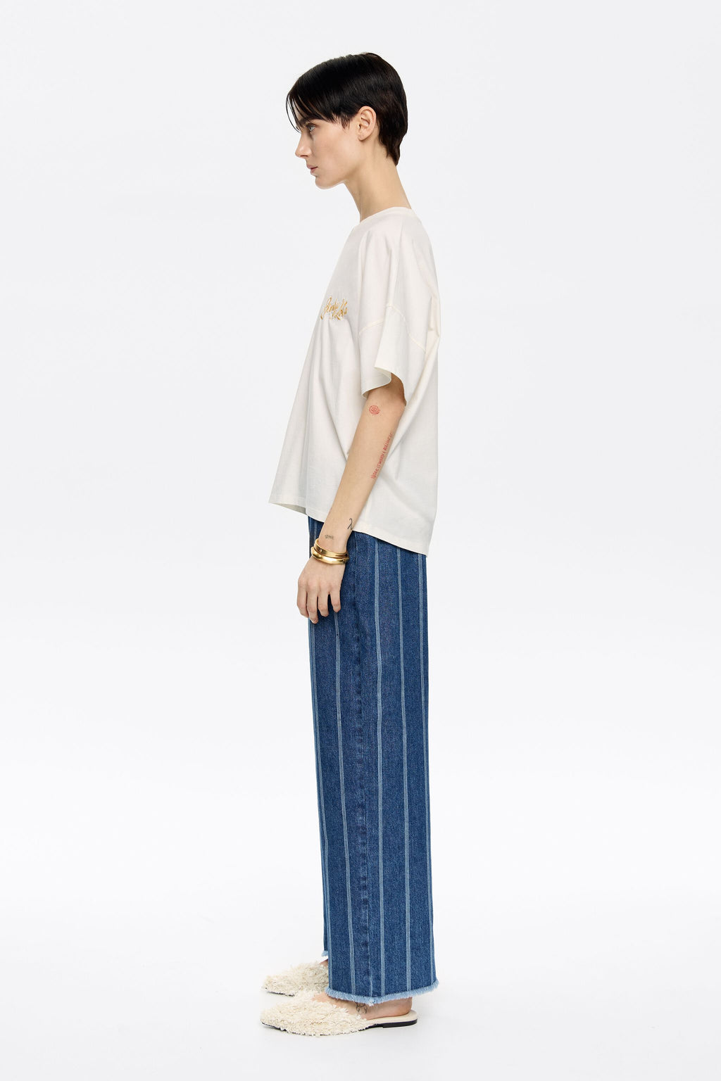 Blue striped frayed denim trousers