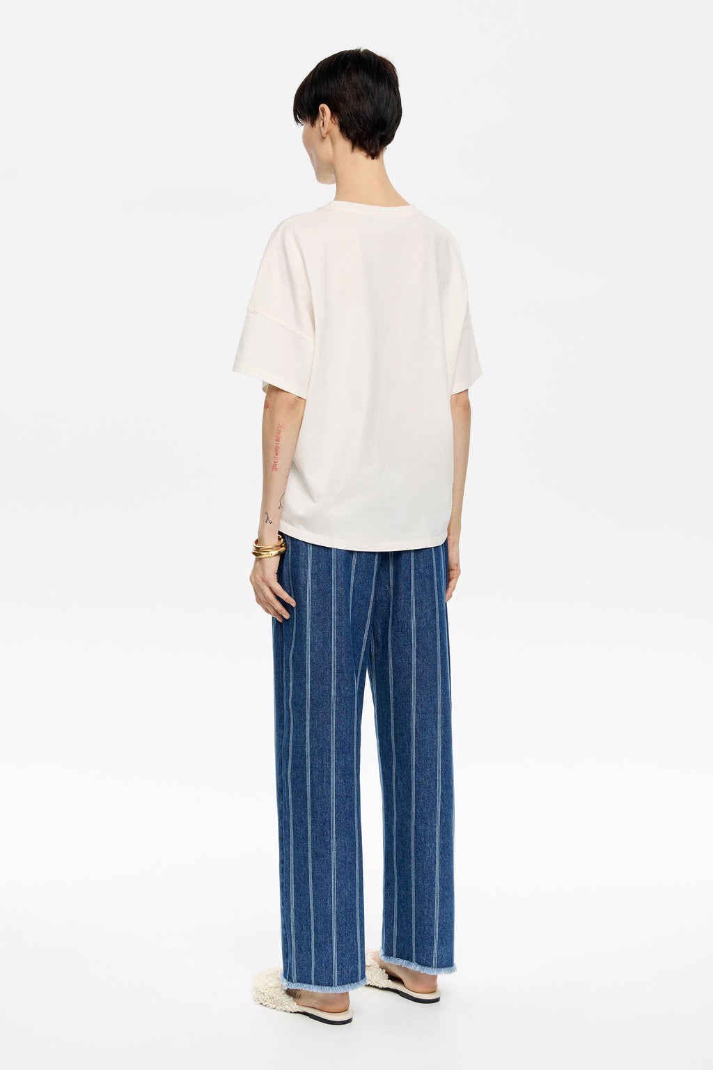 Blue striped frayed denim trousers