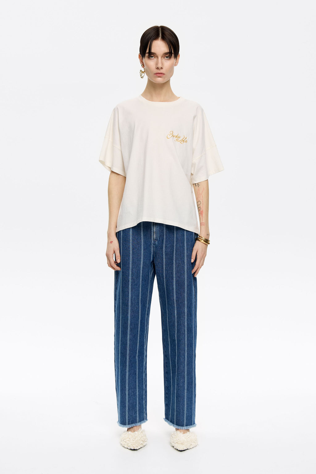 Blue striped frayed denim trousers