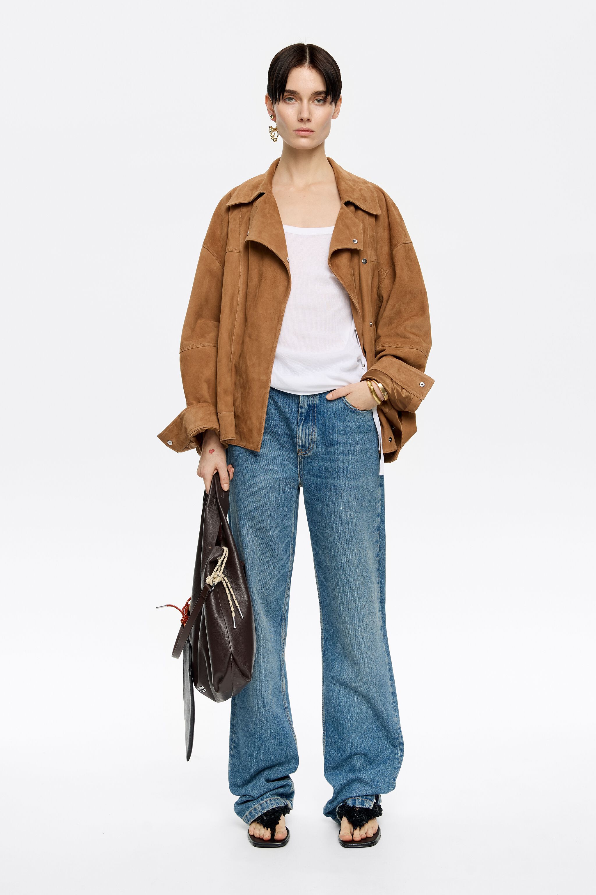 Ivory ribbed T-shirt with metal rings