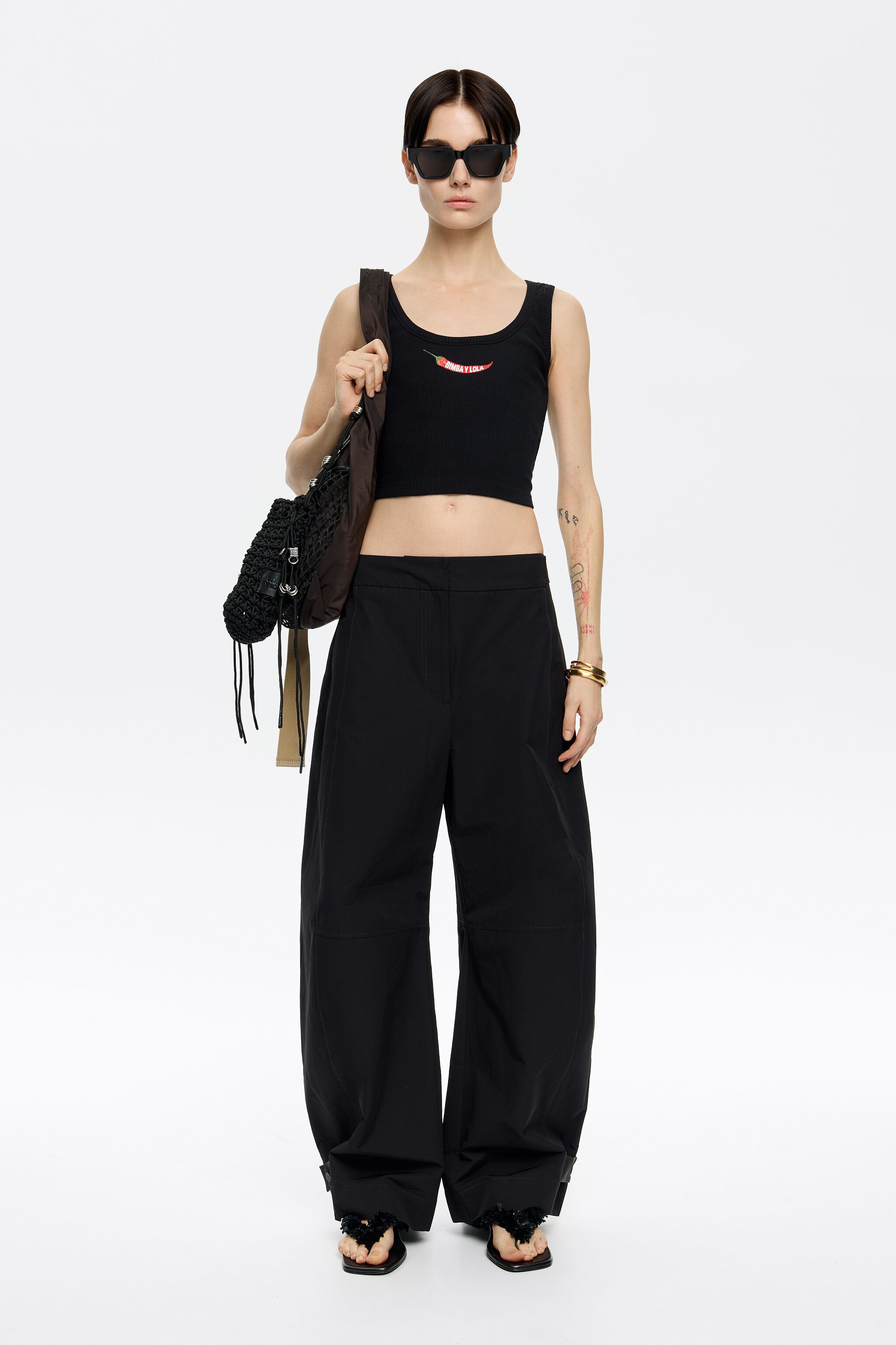 Black short top with chili pepper logo