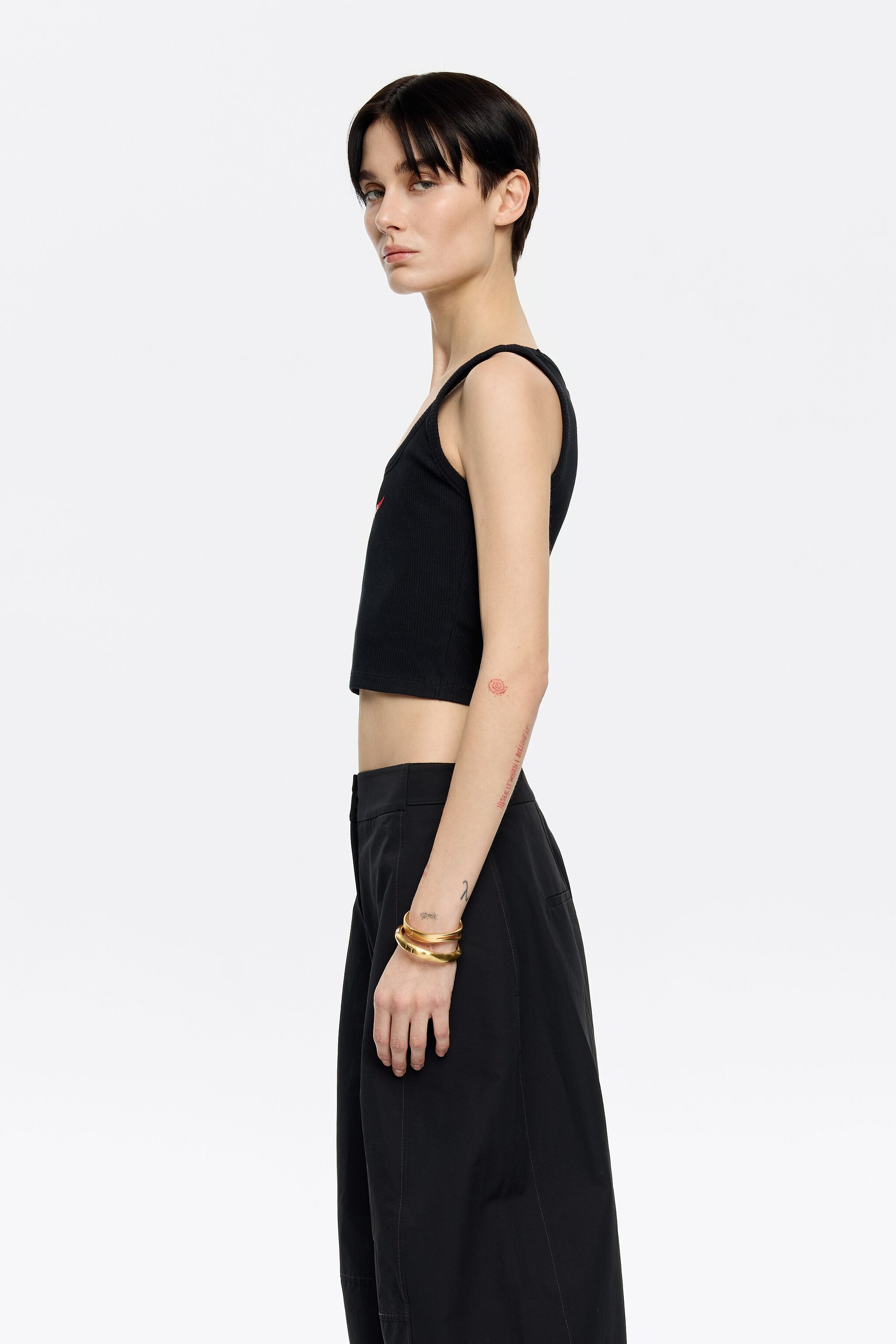 Black short top with chili pepper logo