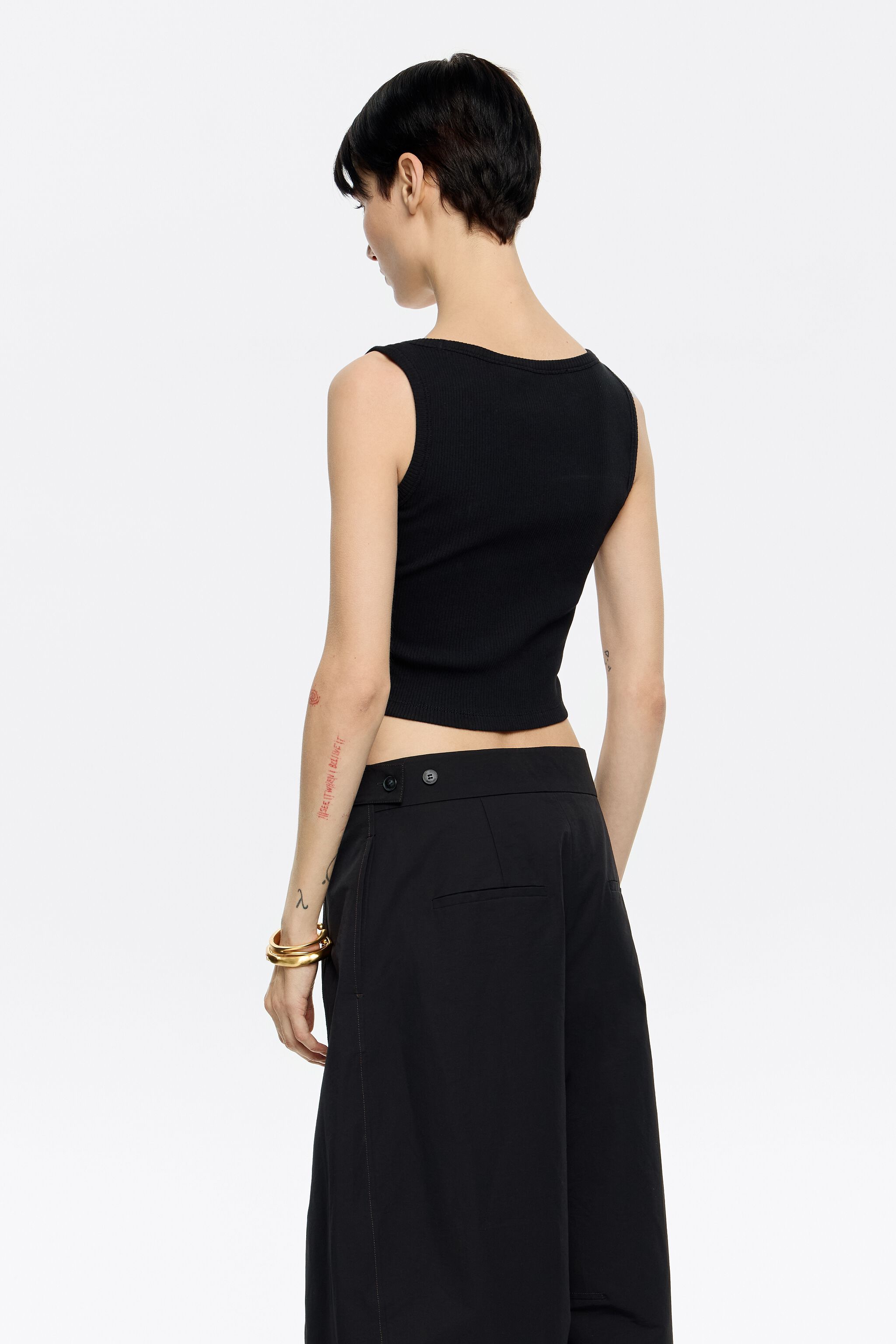 Black short top with chili pepper logo