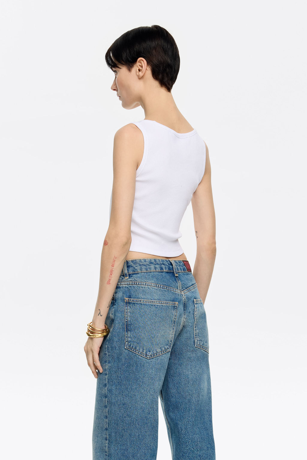 White short top with chili pepper logo