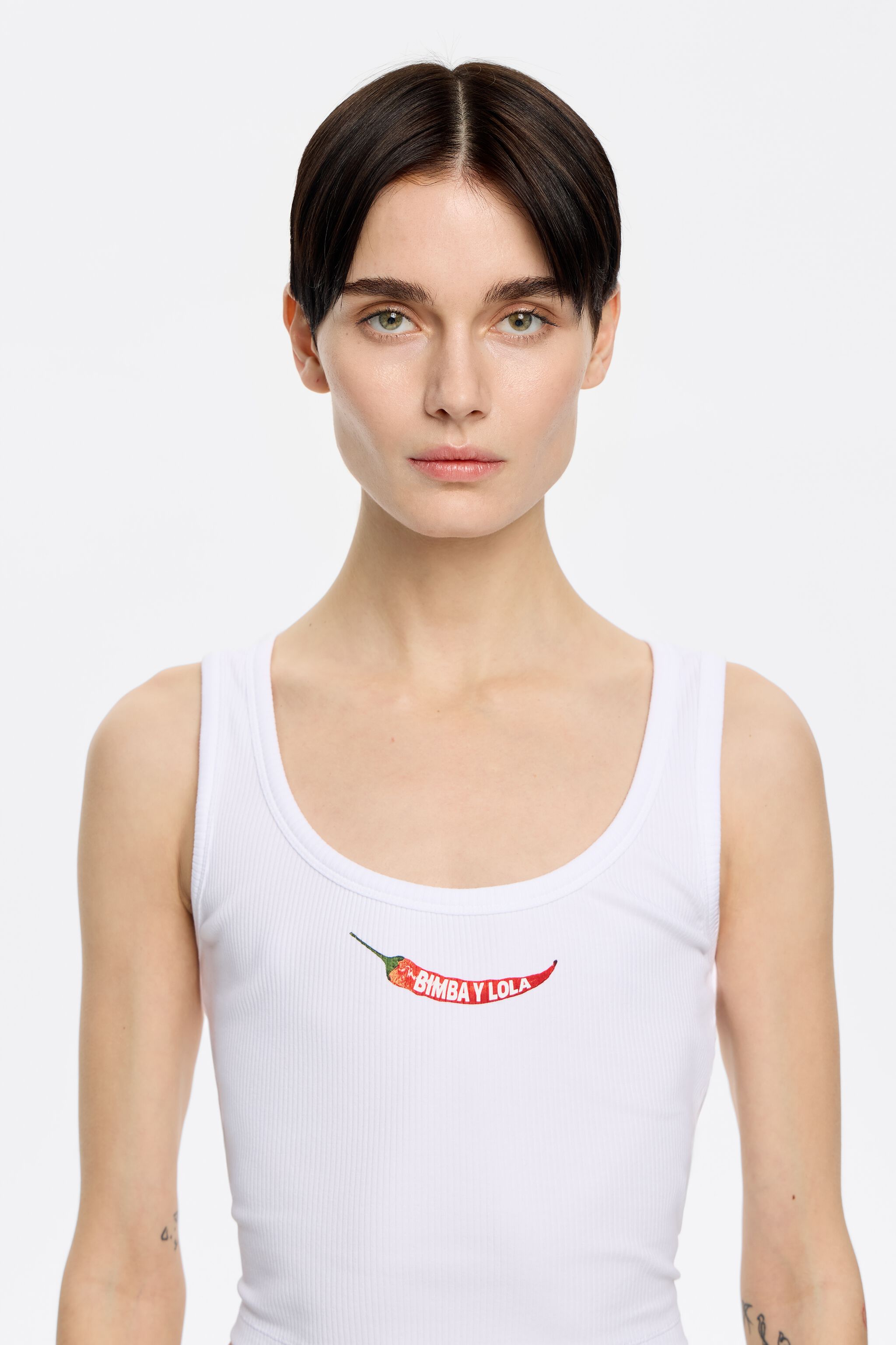 White short top with chili pepper logo