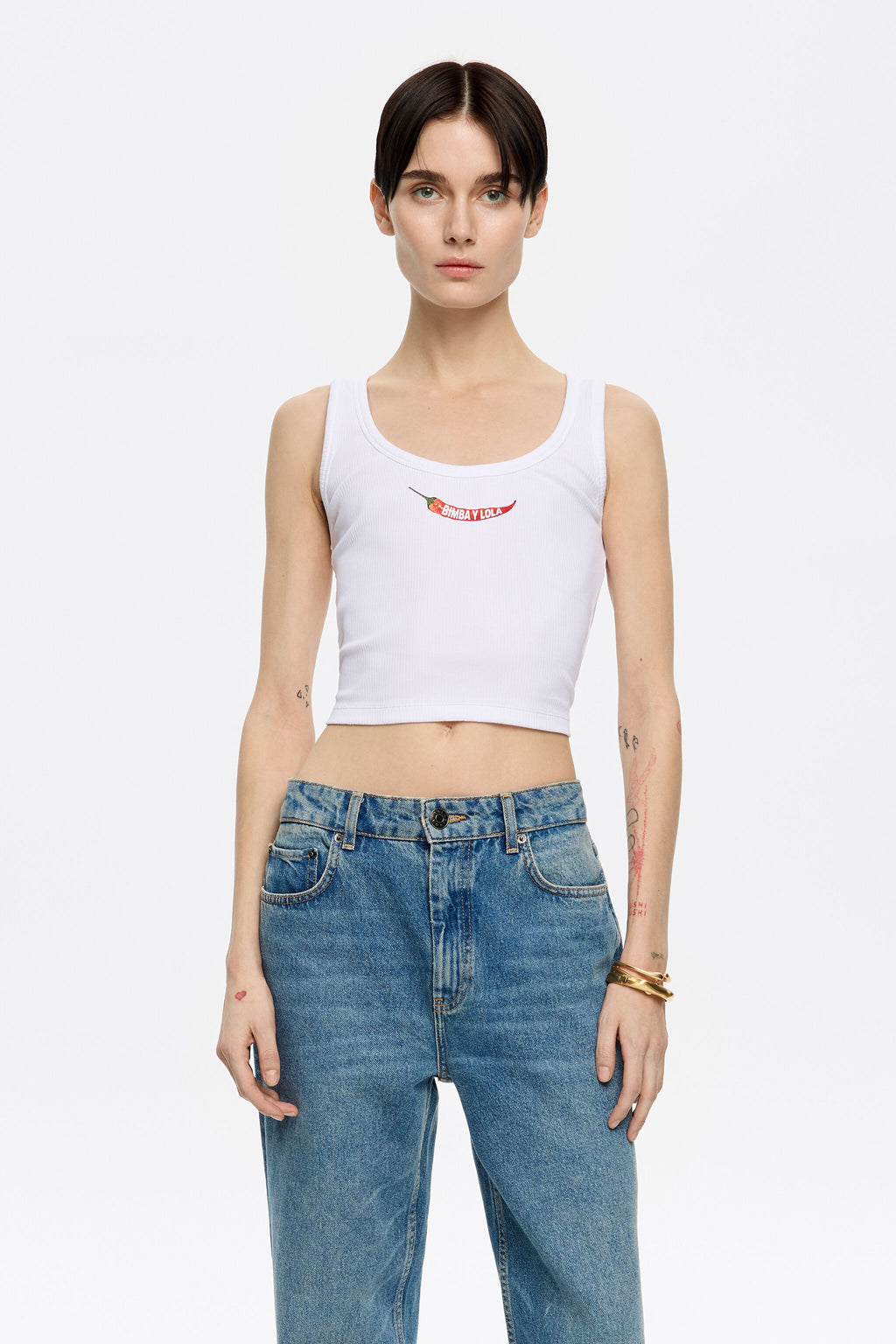 White short top with chili pepper logo