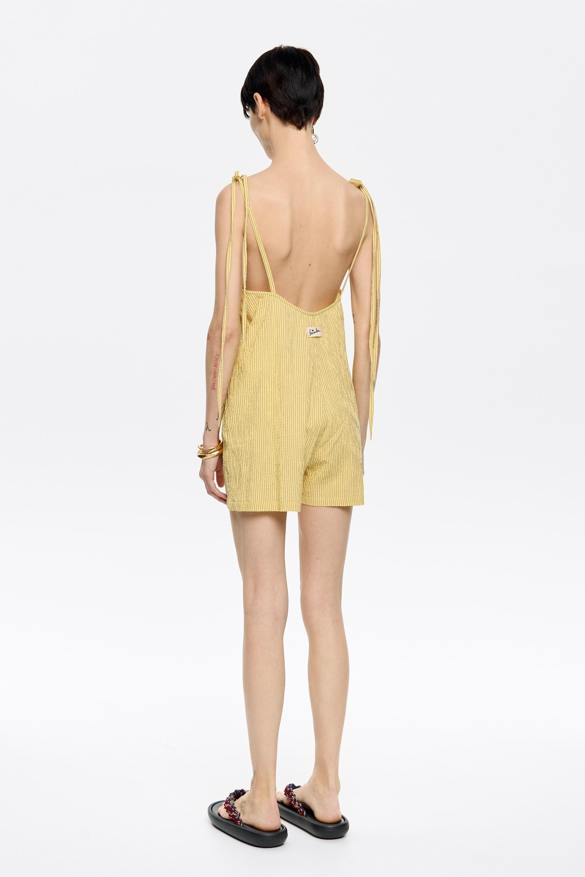 Short yellow striped jumpsuit