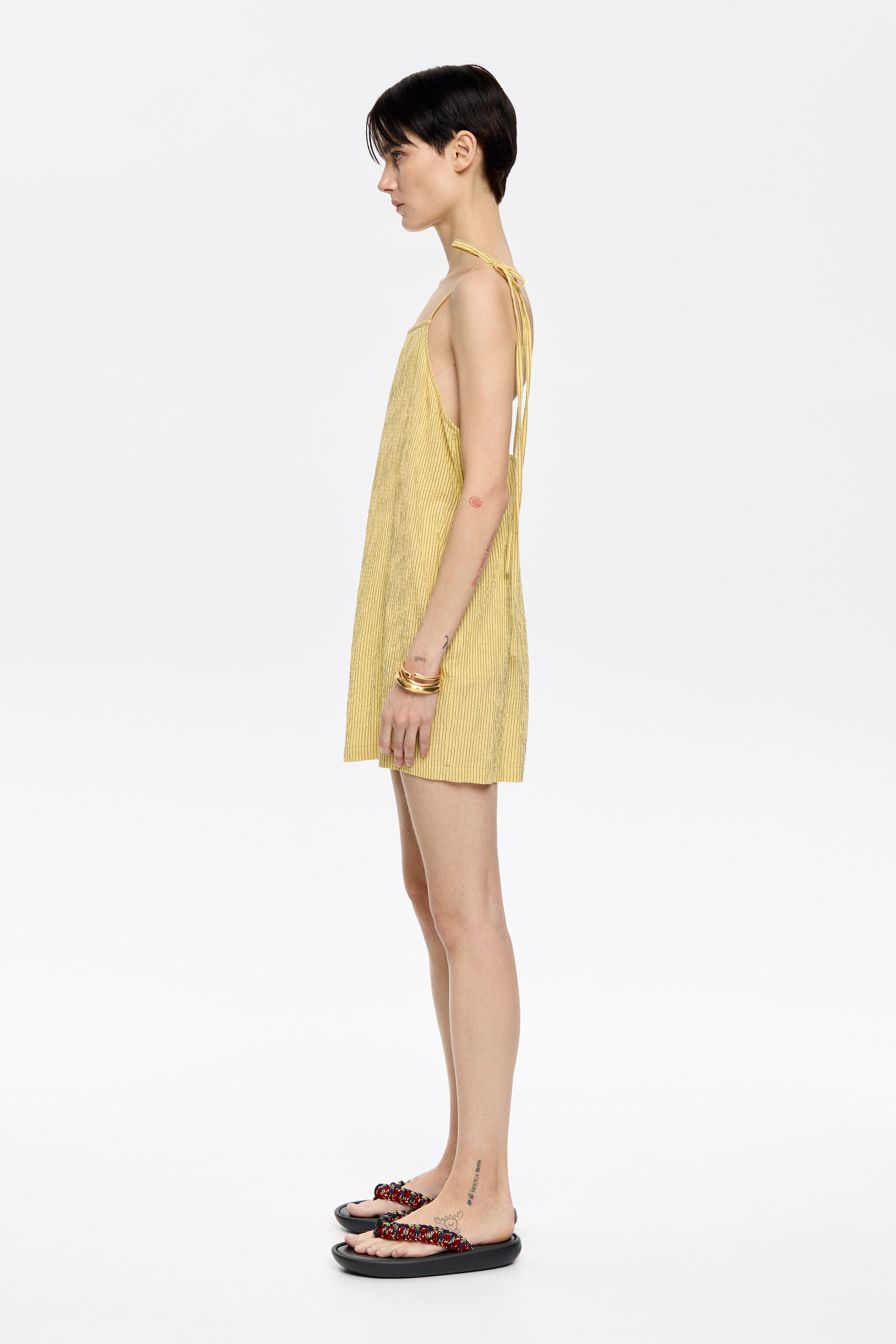 Short yellow striped jumpsuit