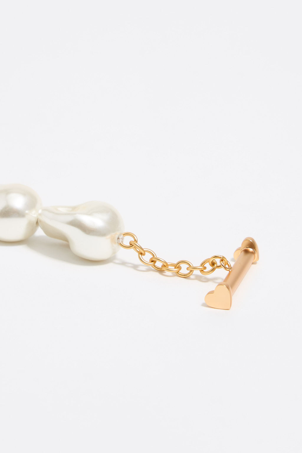 Gold-tone chain and pearl heart logo necklace
