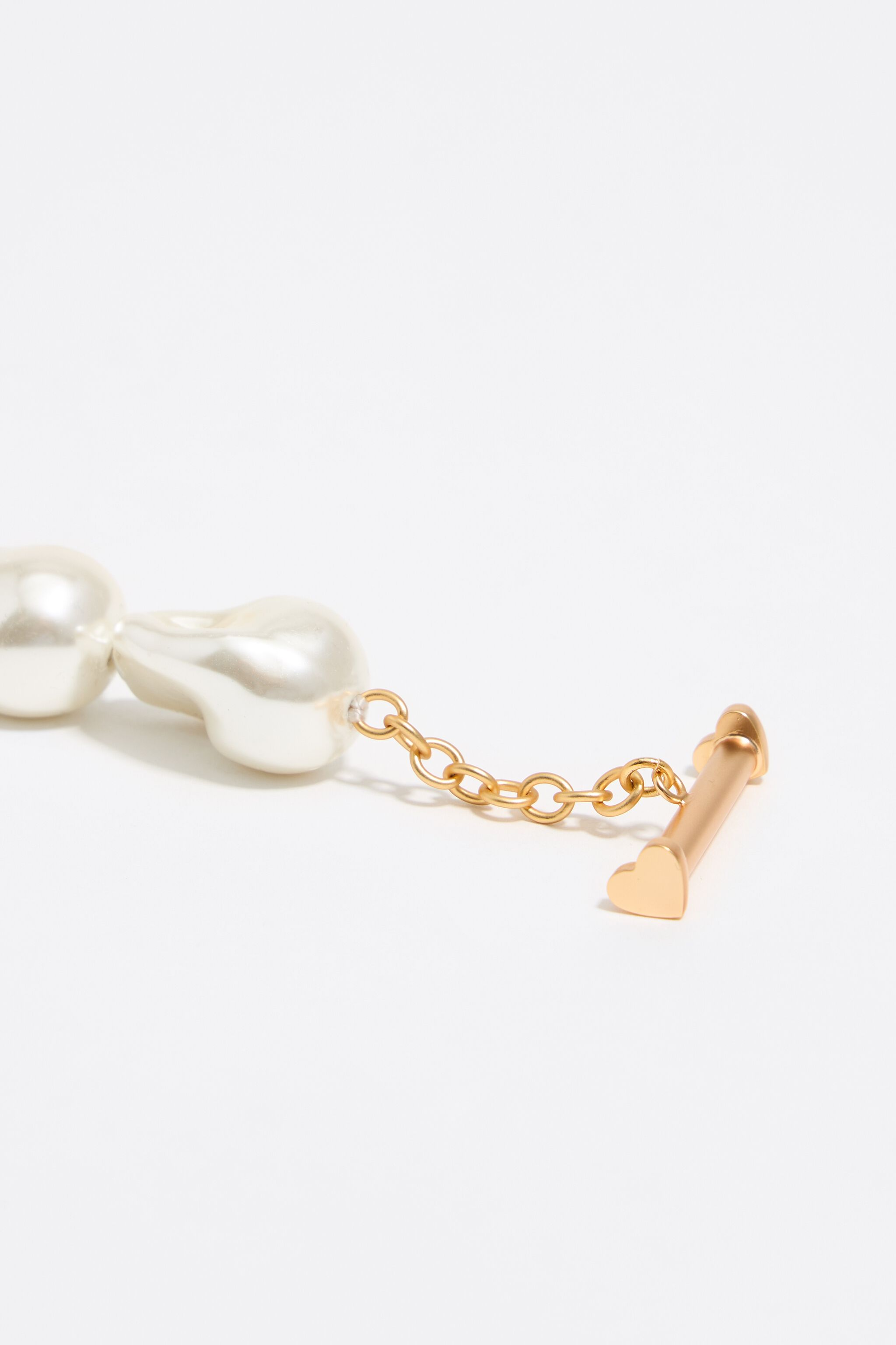 Gold-tone chain and pearl heart logo necklace