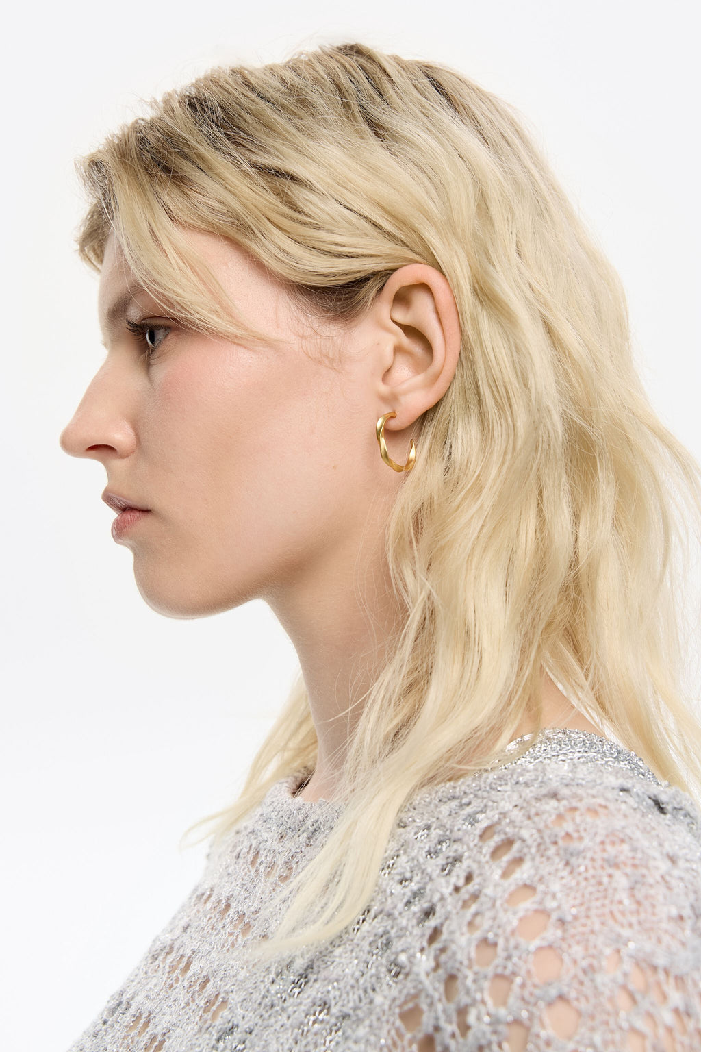 Matte gold uneven hoop earrings