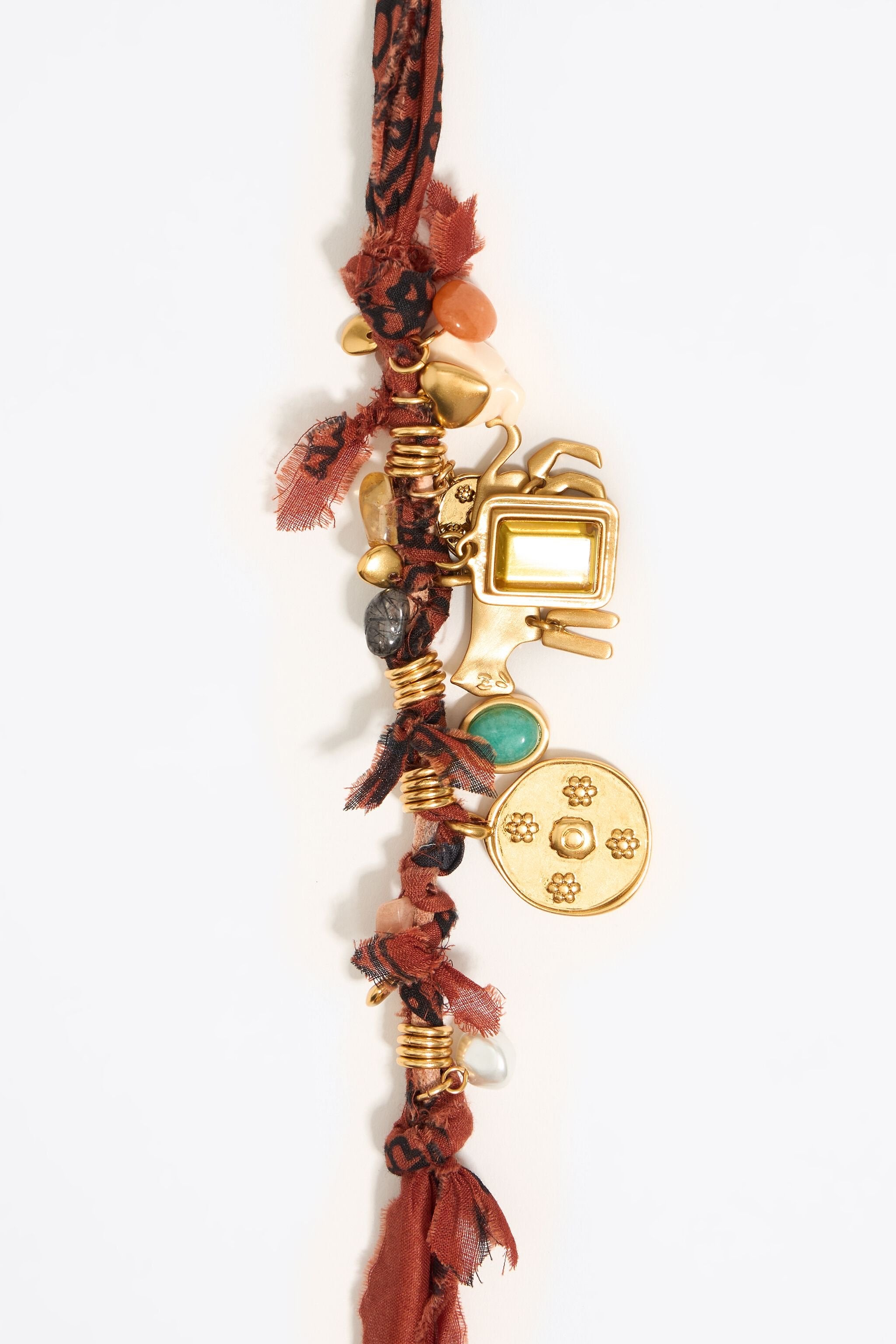 Plaited fabric necklace with gold-tone metal motifs