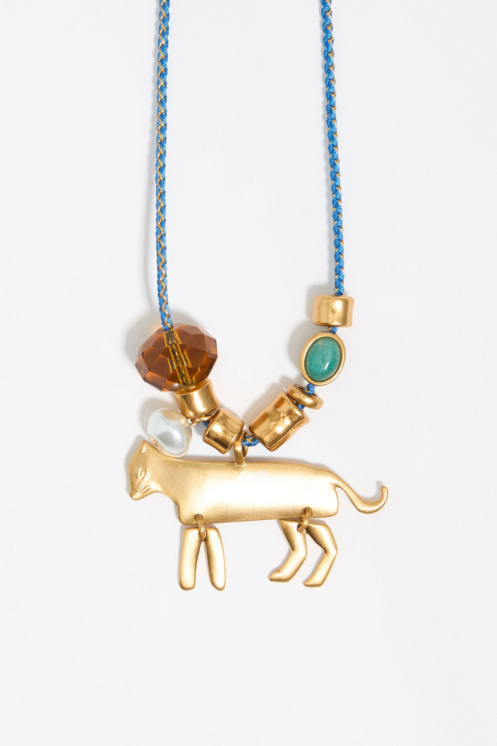 Long plaited cord necklace with gold-tone metal motifs