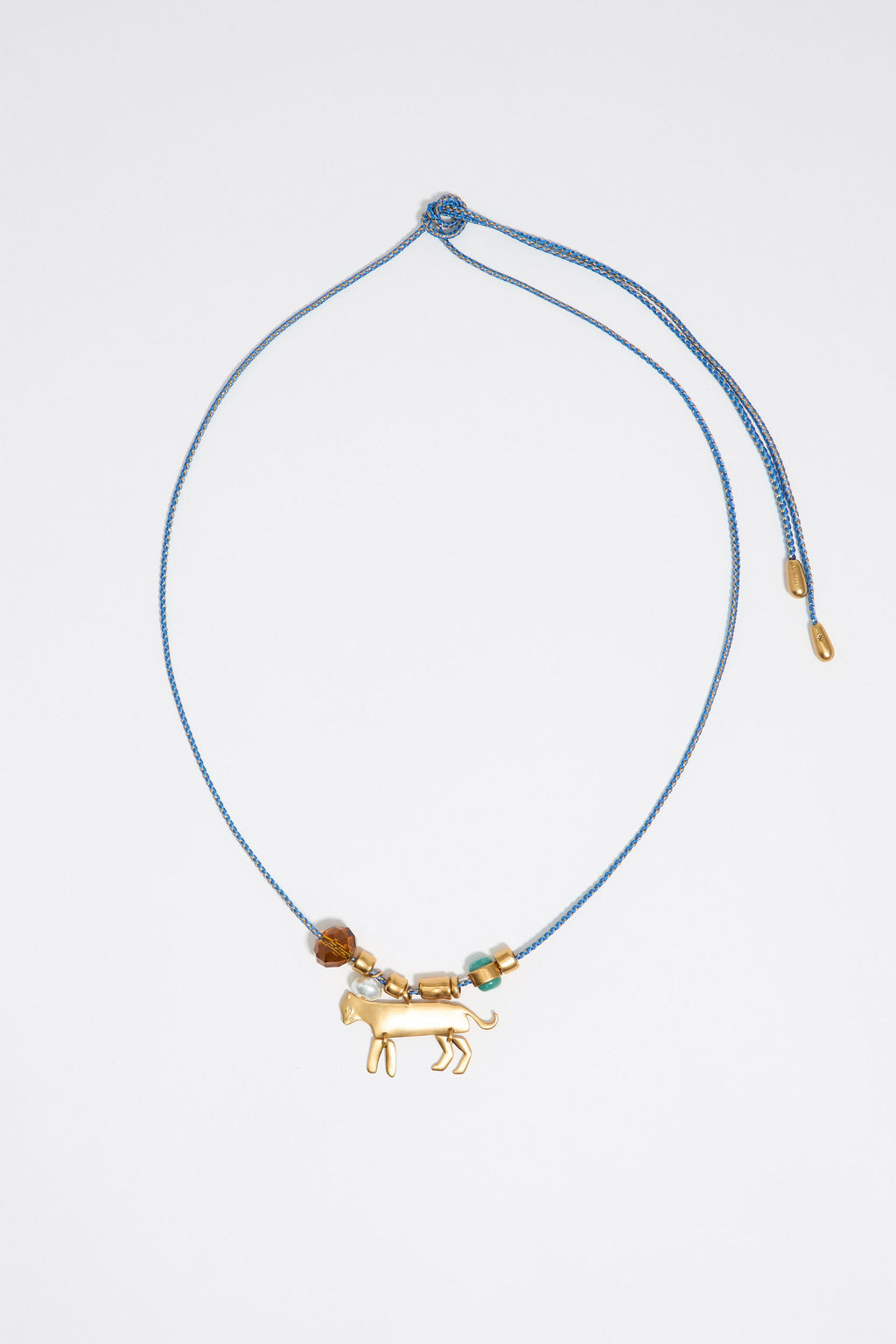 Long plaited cord necklace with gold-tone metal motifs