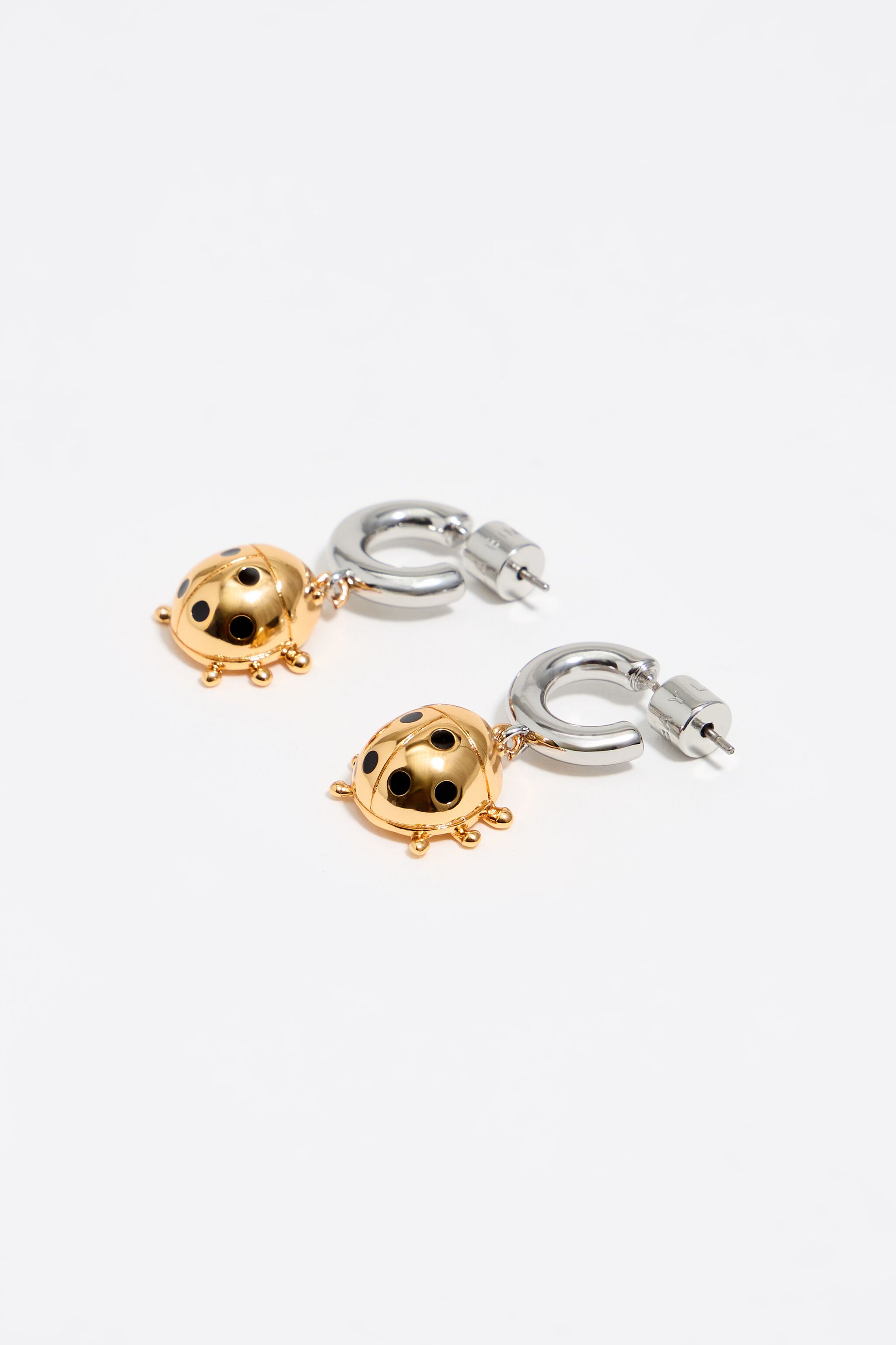 Two-tone ladybug hoop earrings
