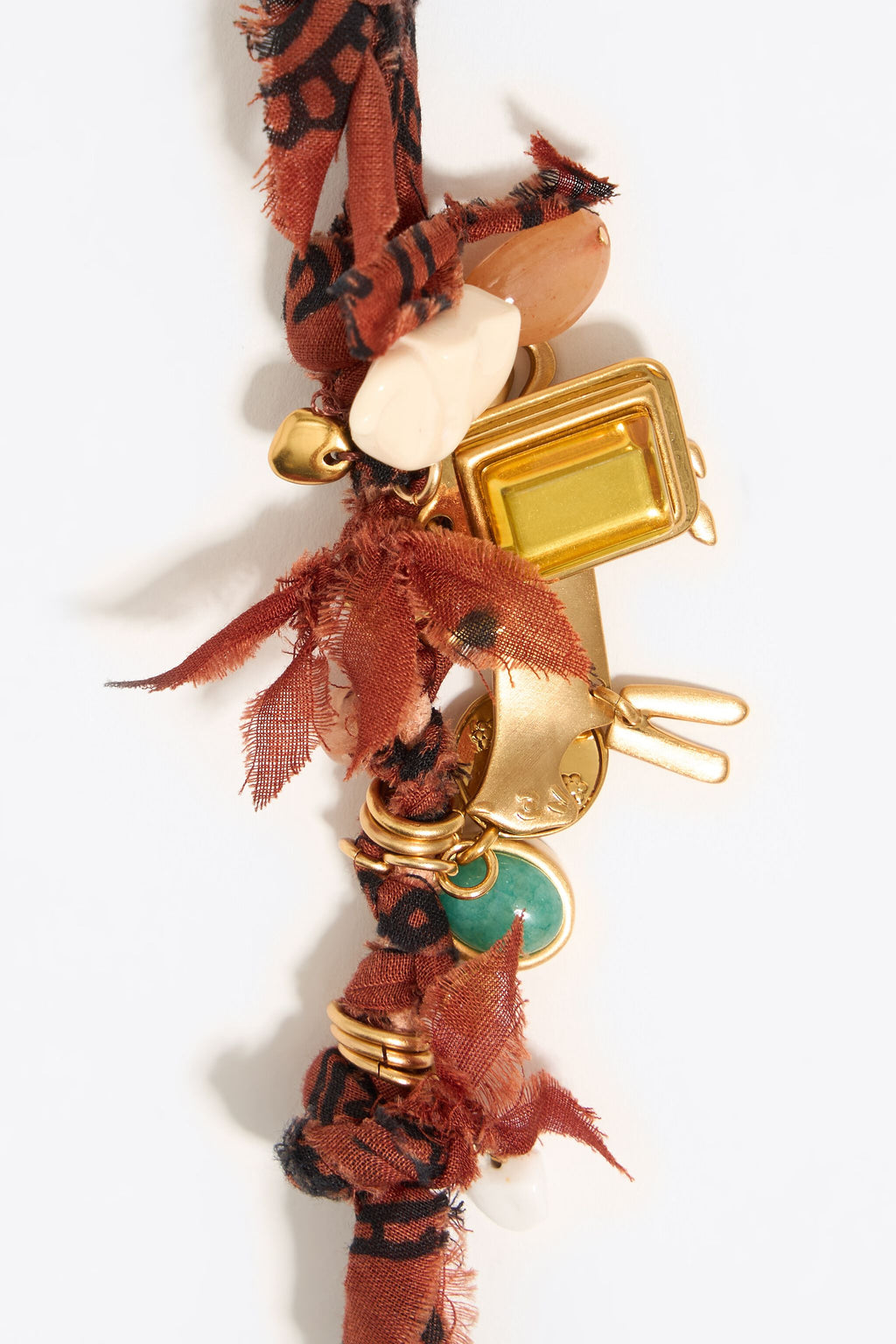 Plaited fabric bracelet with gold-tone metal pieces