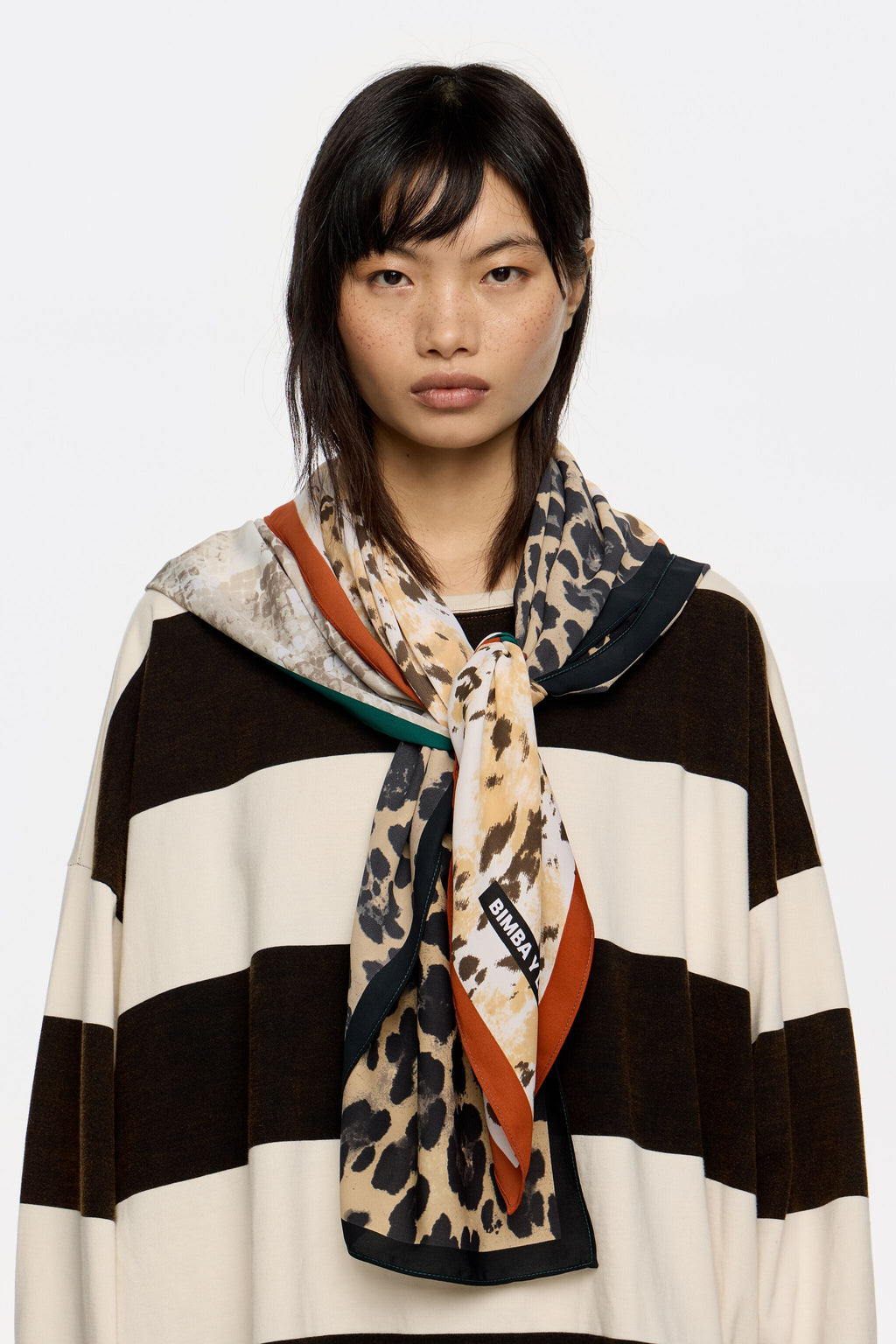 Beige animal print patchwork scarf with contrast borders