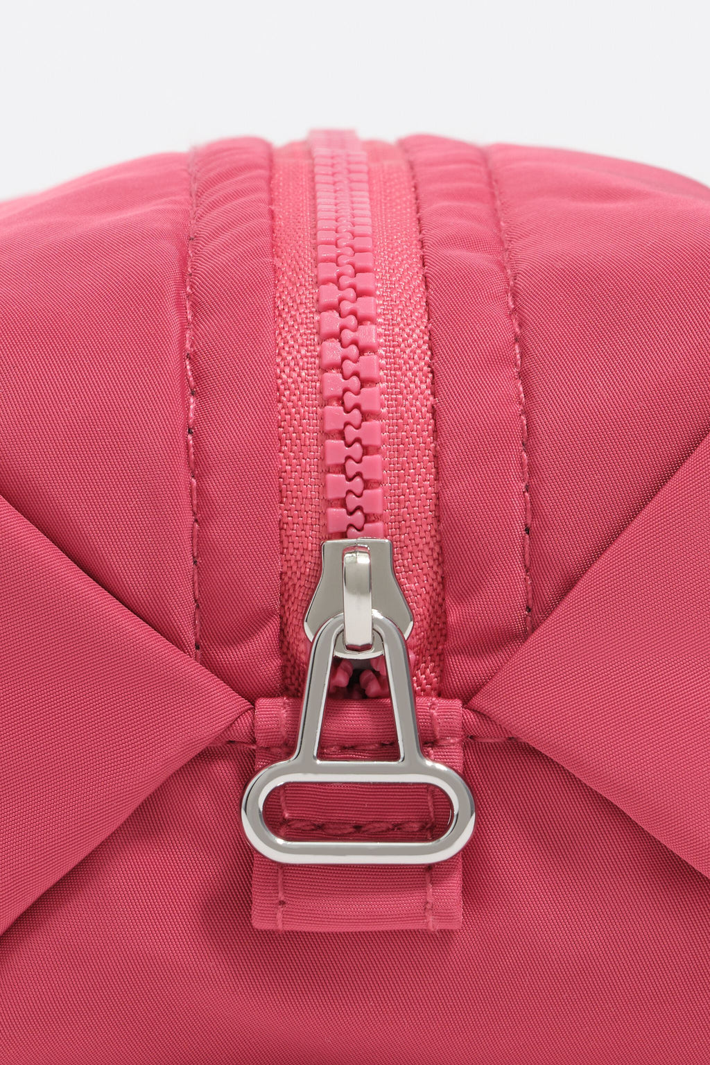 Small dark pink nylon make-up case